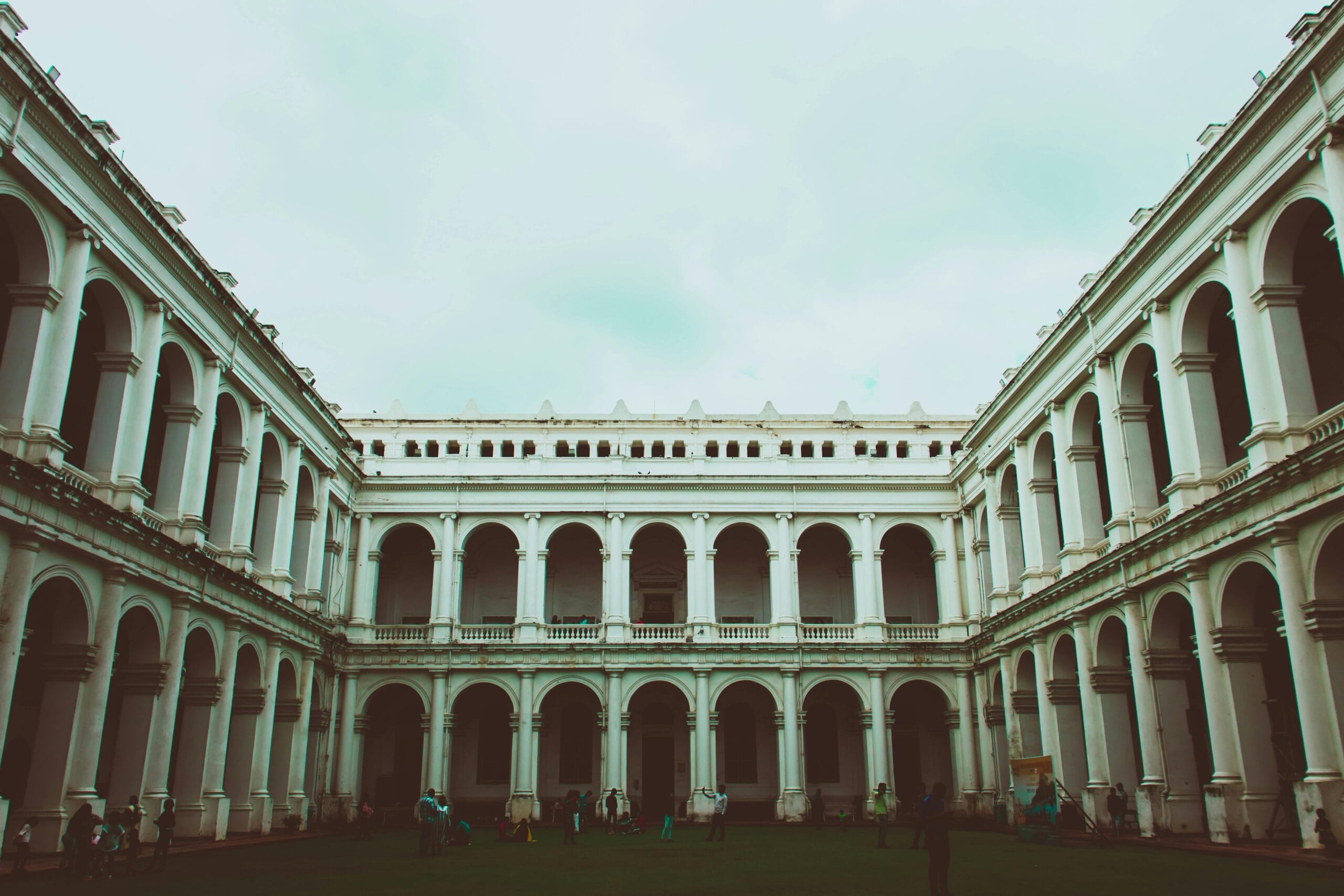 Exterior view of the historic Indian Museum in Kolkata showcasing classic colonial architecture with arches and columns.